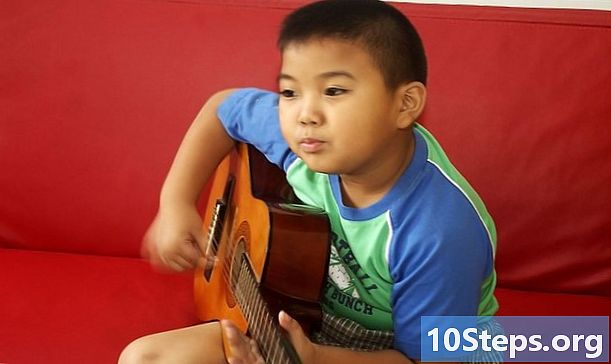 Com ensenyar als nens a tocar la guitarra