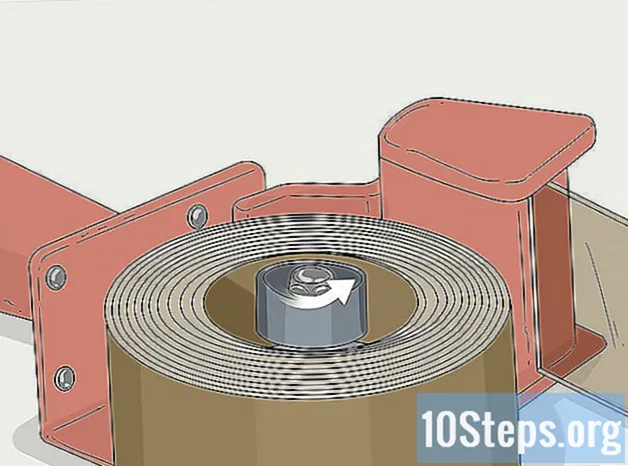 Kā ievietot iepakojuma lentes dozatoru